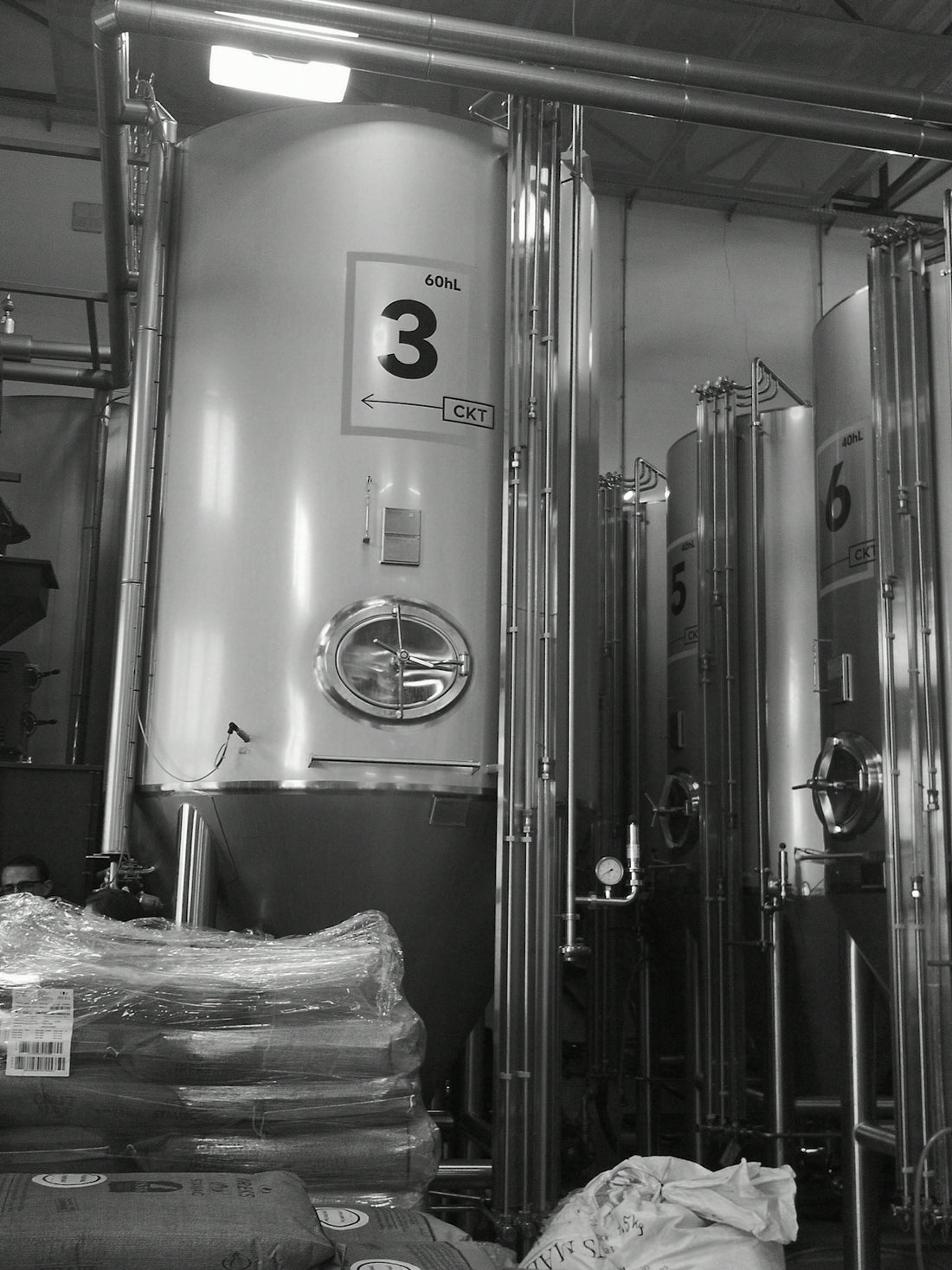 a black and white photo of a brewery