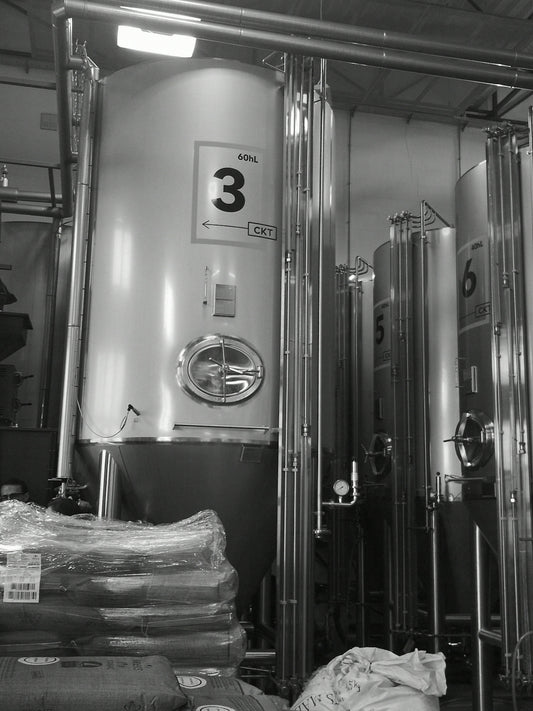 a black and white photo of a brewery