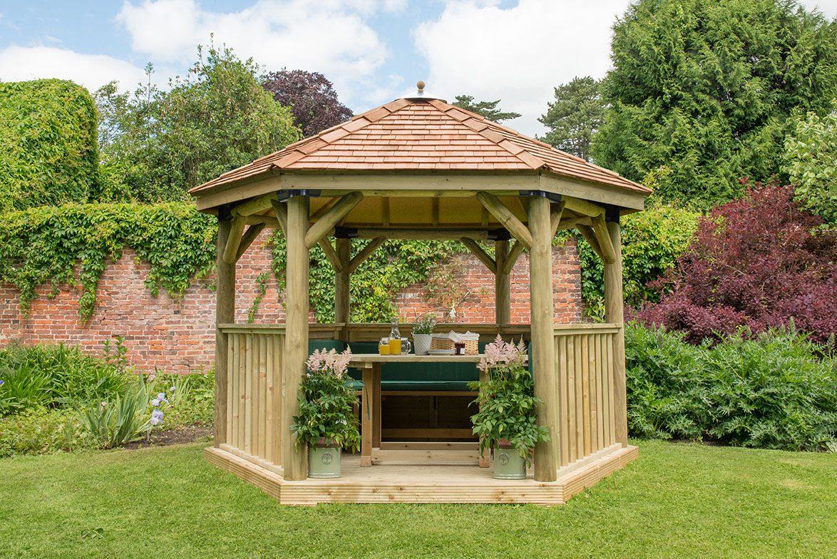 Forest 3.6m Hexagonal Wooden Garden Gazebo with Cedar Roof - Furnished with Table, Benches and Cushions - JJ Building Materials