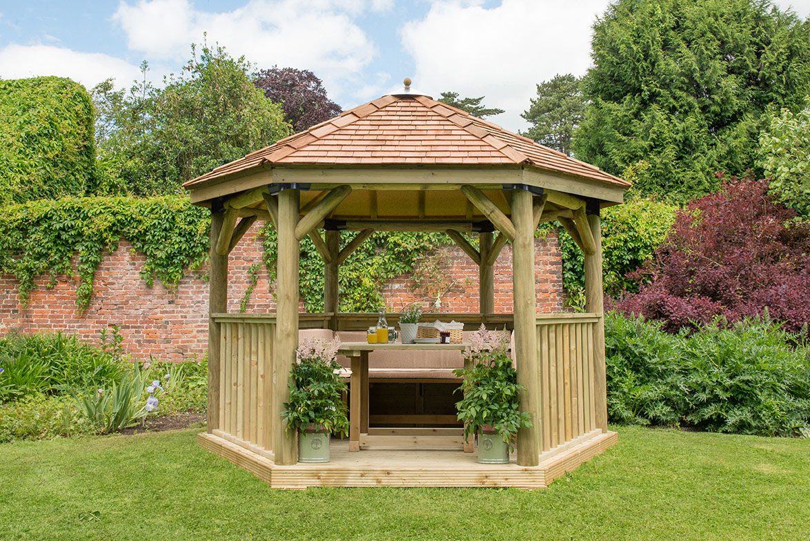 Forest 3.6m Hexagonal Wooden Garden Gazebo with Cedar Roof - Furnished with Table, Benches and Cushions - JJ Building Materials