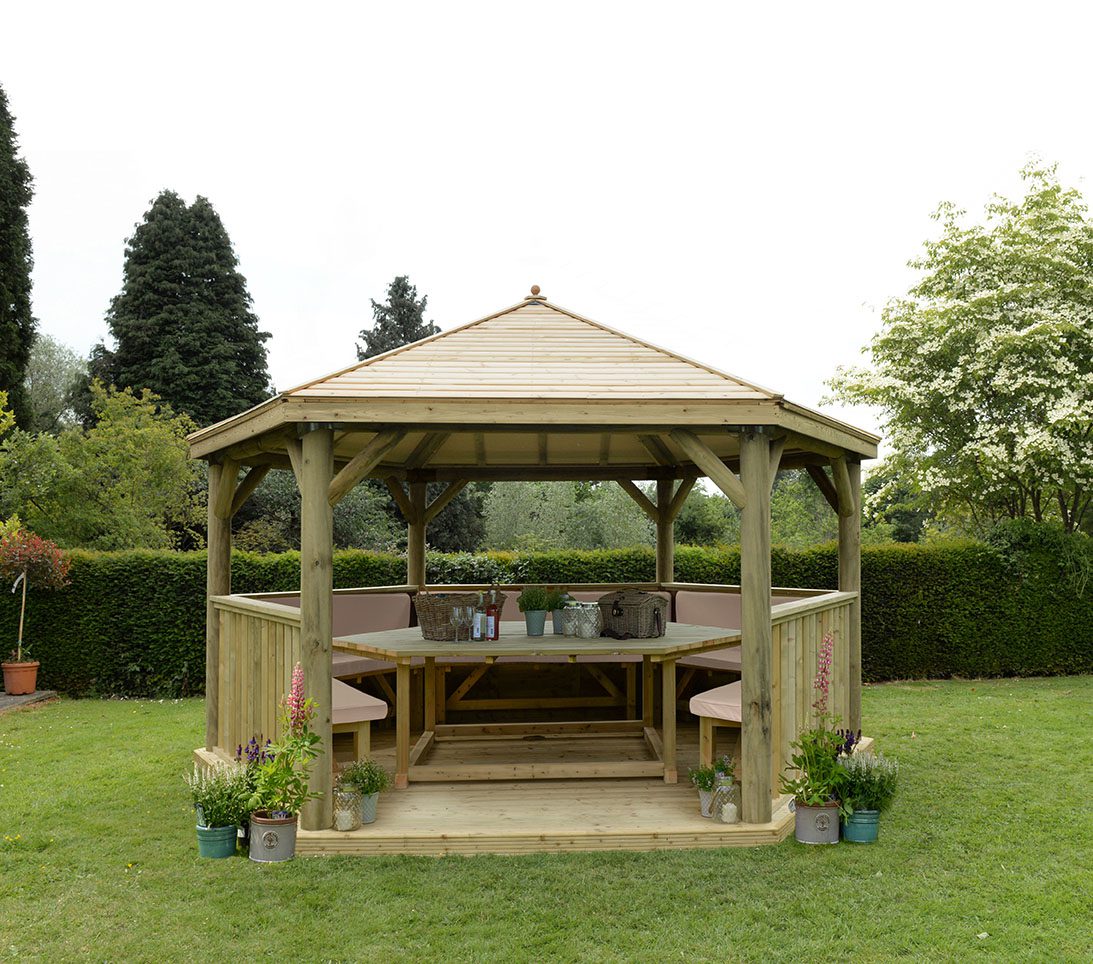 Forest 4.7m Hexagonal Wooden Garden Gazebo with Timber Roof - Furnished with Table, Benches and Cushions - JJ Building Materials