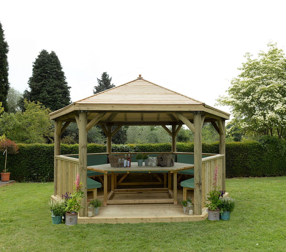Forest 4.7m Hexagonal Wooden Garden Gazebo with Timber Roof - Furnished with Table, Benches and Cushions - JJ Building Materials