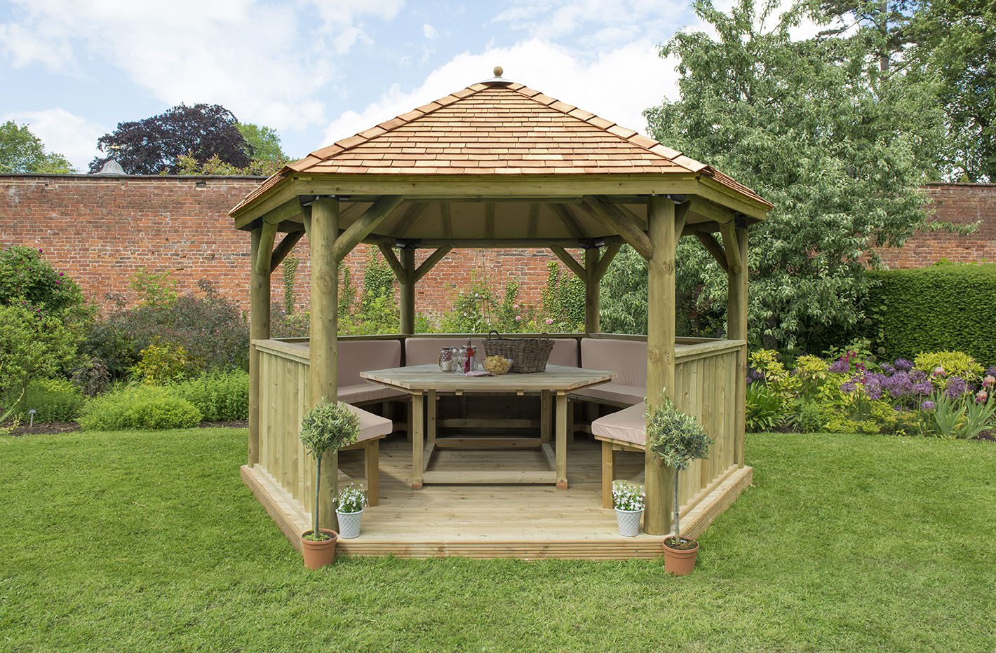 Forest 4m Hexagonal Wooden Garden Gazebo with Cedar Roof - Furnished with Table, Benches and Cushions - JJ Building Materials