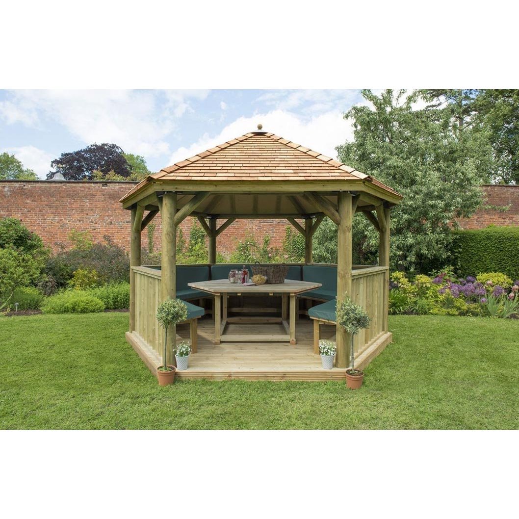 Forest 4m Hexagonal Wooden Garden Gazebo with Cedar Roof - Furnished with Table, Benches and Cushions - JJ Building Materials