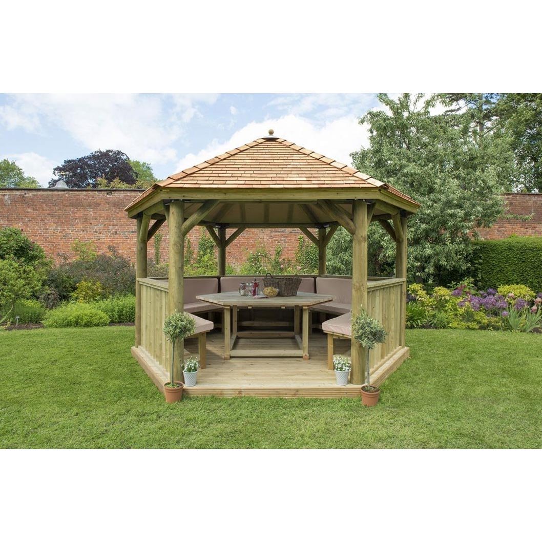 Forest 4m Hexagonal Wooden Garden Gazebo with Cedar Roof - Furnished with Table, Benches and Cushions - JJ Building Materials